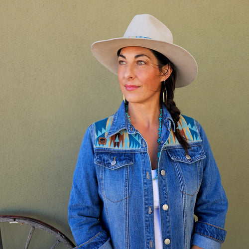 Front view of the Rancho Arroyo Aqua denim duster showing turquoise geometric wool panels across the shoulders.