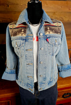 Front of the Spirit of the People denim jacket on a mannequin, with patterned wool yokes and rolled sleeves.