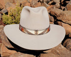 Pacific Crest wool hat band with a centered cream geometric motif fitted around a light felt hat.