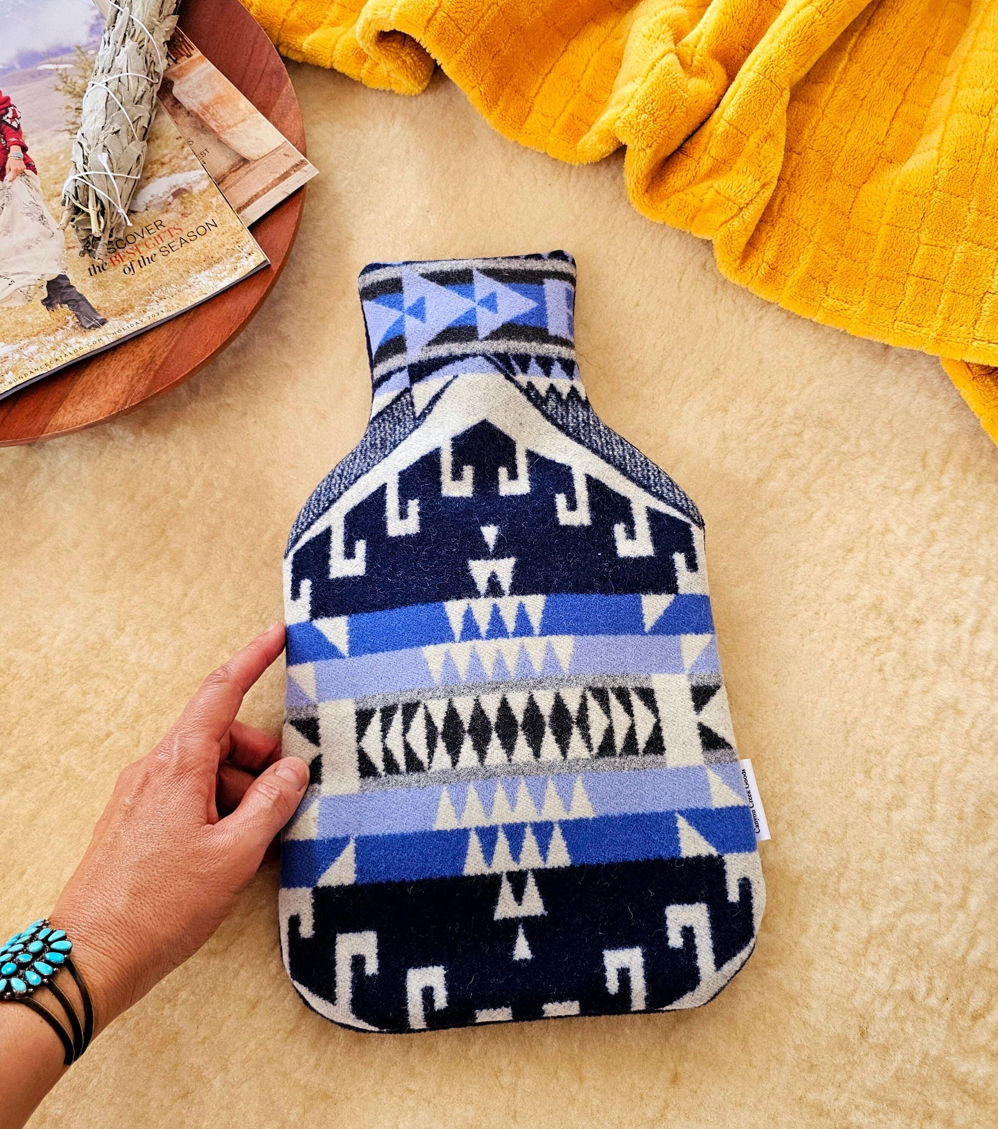 Wool hot water bottle cover, featuring southwest designs in Pendleton wool Trailhead Blue pattern.