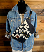 Condensed White crossbody sling with bold black and cream geometric fabric, worn over a denim jacket.